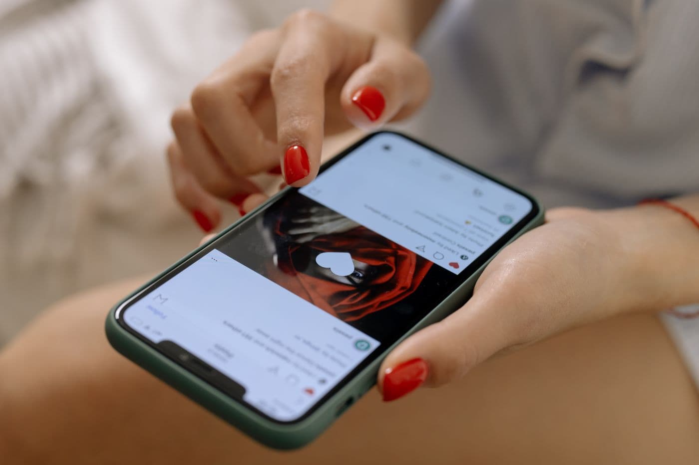 Close-up of a woman using Instagram on a smartphone