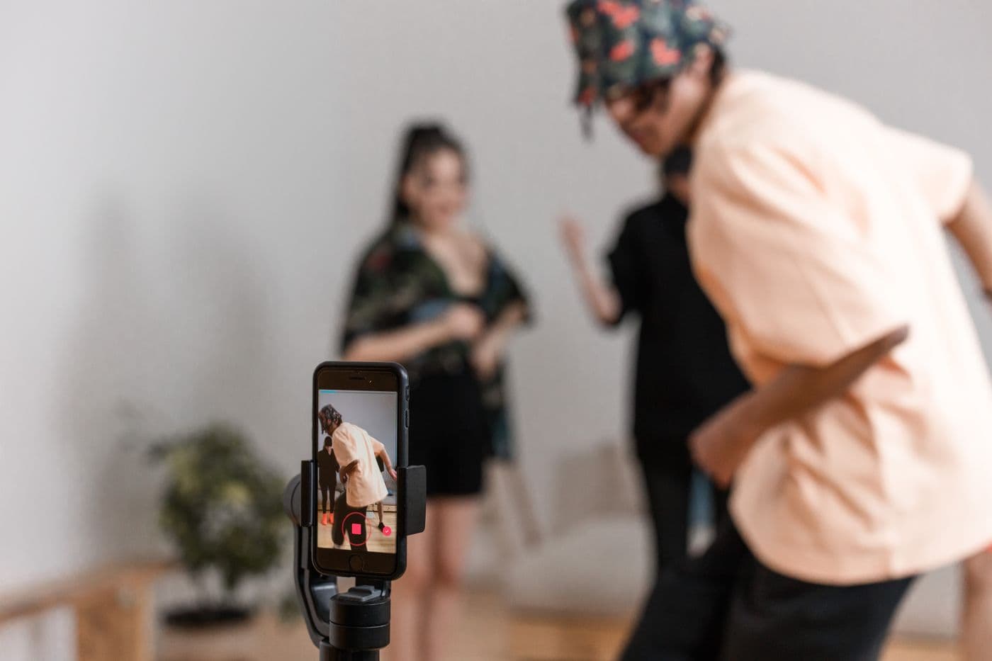 People recording a video on a smartphone for social media